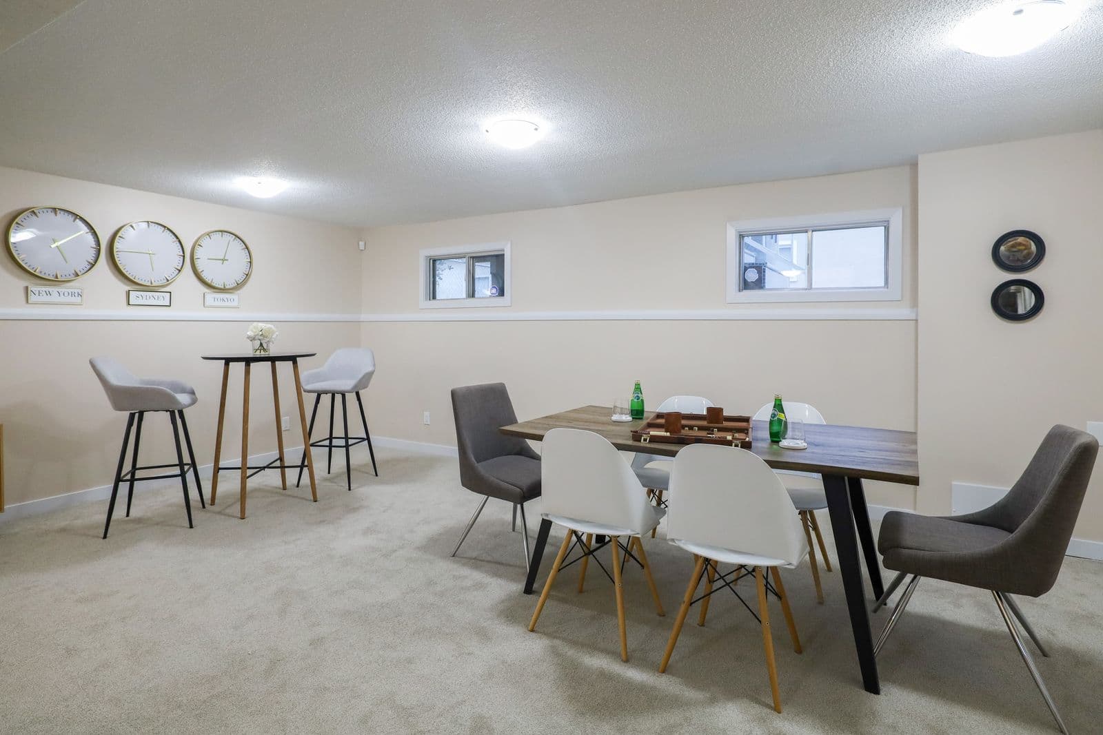 Stylish basement dining and living area with minimalist decor